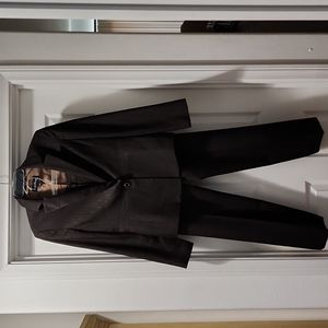 Modern brown pinstripe pant suit.  Jacket has a nice slimming trim